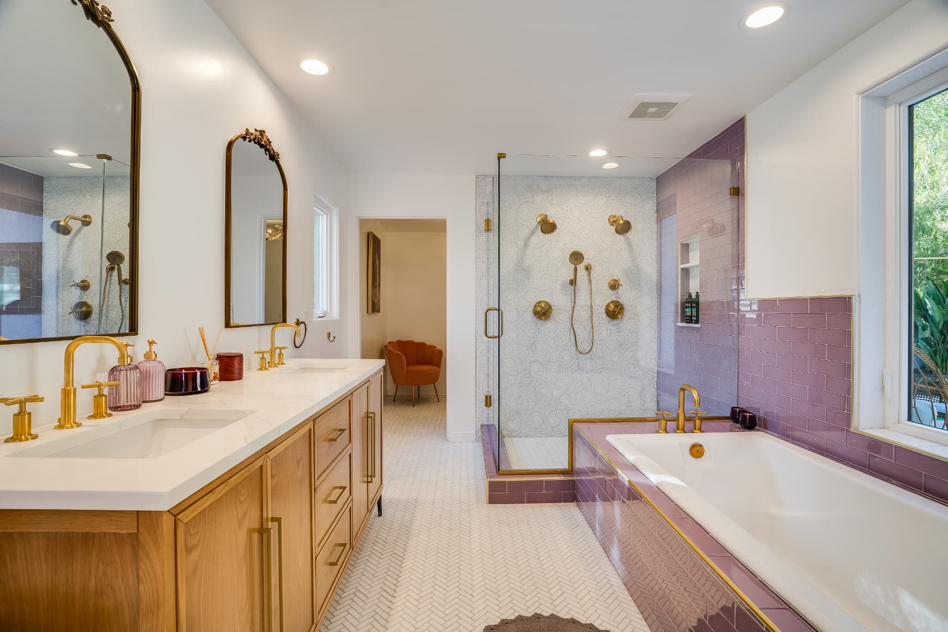 Primary bathroom remodel in Studio City with white oak double vanity, quartz counters, brass fixtures, and lilac tile